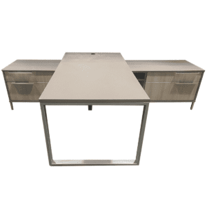 Used 71"W Two-Tone Executive Credenza Desk With Metal O-Leg Executive workstation featuring a two-tone matte gray and woodgrain finish, a metal O-leg base, and a layered credenza that provides generous storage and workspace. Polished metal pull handles complete the clean, modern aesthetic. Two-tone matte gray with woodgrain accent finish Metal O-leg design layered credenza with polished metal pull handles Commercial-grade construction Dimensions: Desk: 72"W x 36"D x 30"H Layered Credenza: 114"W x 24"D x 26"H Ideal for executive offices and professional work environments.