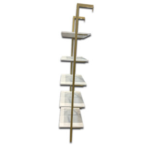 Used 74" H White & Gold 5-Shelf Wall Mounted Bookcase This display shelf features five white laminate shelves supported by a gold metal frame, offering a modern storage and display solution. The open design provides visibility from all sides, ideal for organizing or showcasing items. White laminate shelves Gold metal frame Five-tier open shelving design Dimensions: 25"W x 15"D x 74"H Perfect for offices, showrooms, or residential display spaces.